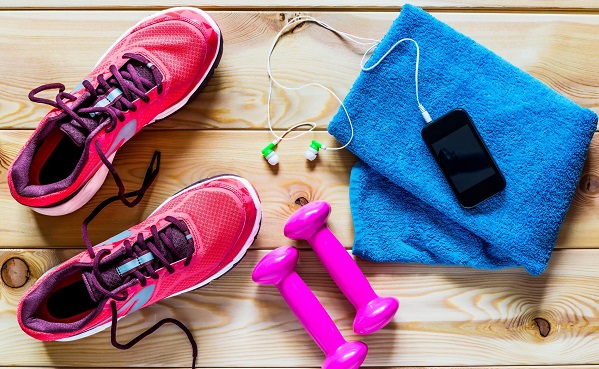 Towel and smartphone and running shoes and weight